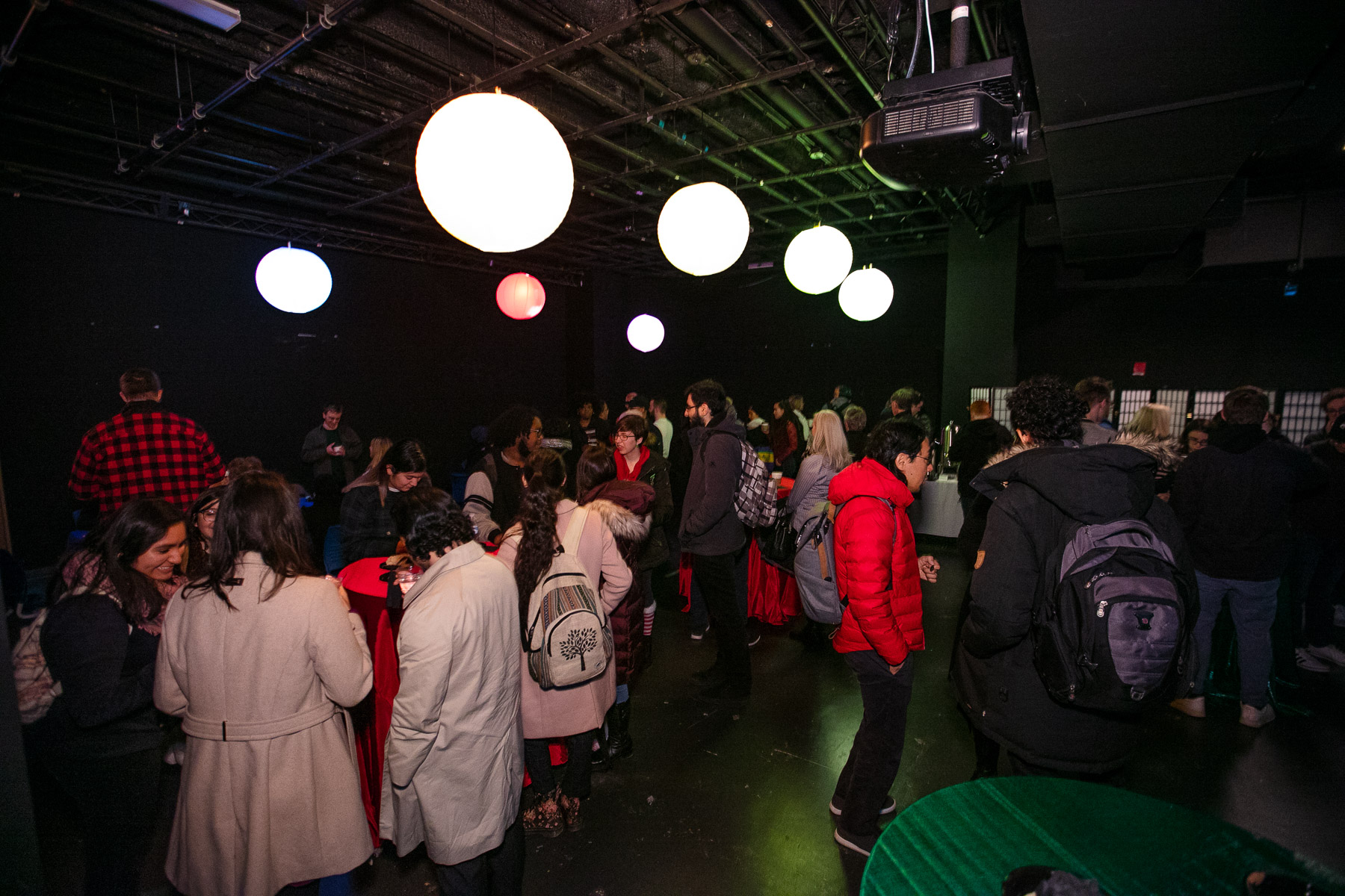 The DePaul community, family and guests were invited for a post-unveiling reception which included hot chocolate and holiday treats on the Digital Cinema Stage. (DePaul University/Randall Spriggs)